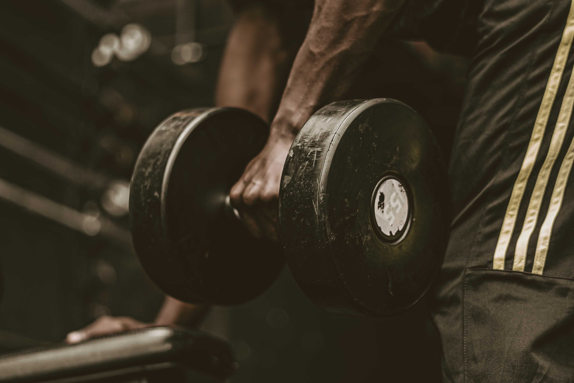 A Person Holding a Dumbbell